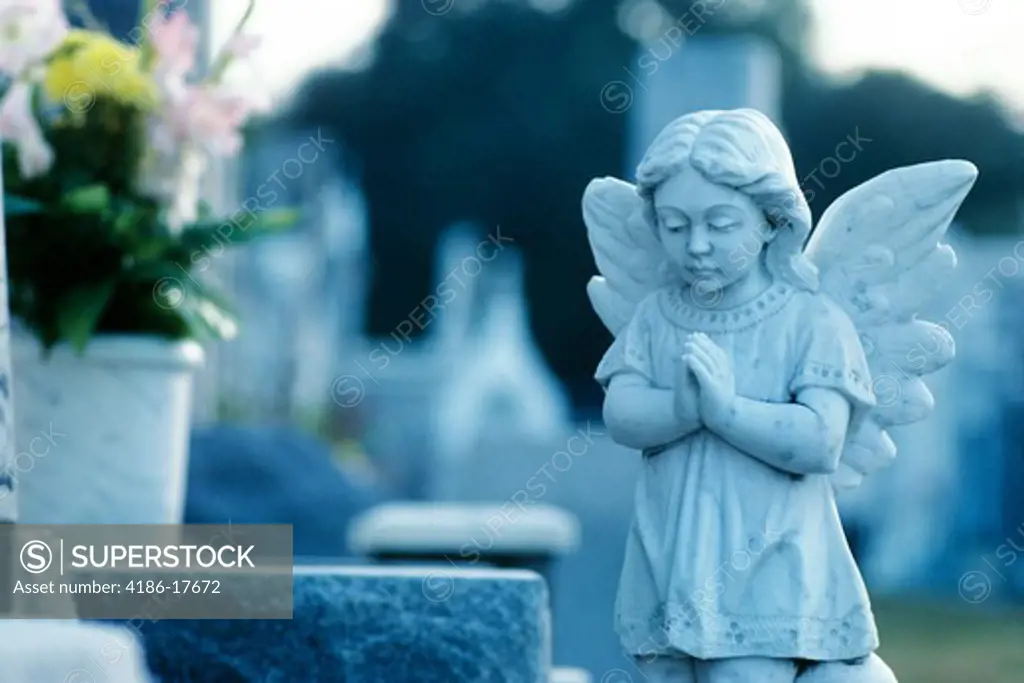 Praying Angel Statue On Grave Cemetery New Orleans Louisiana
