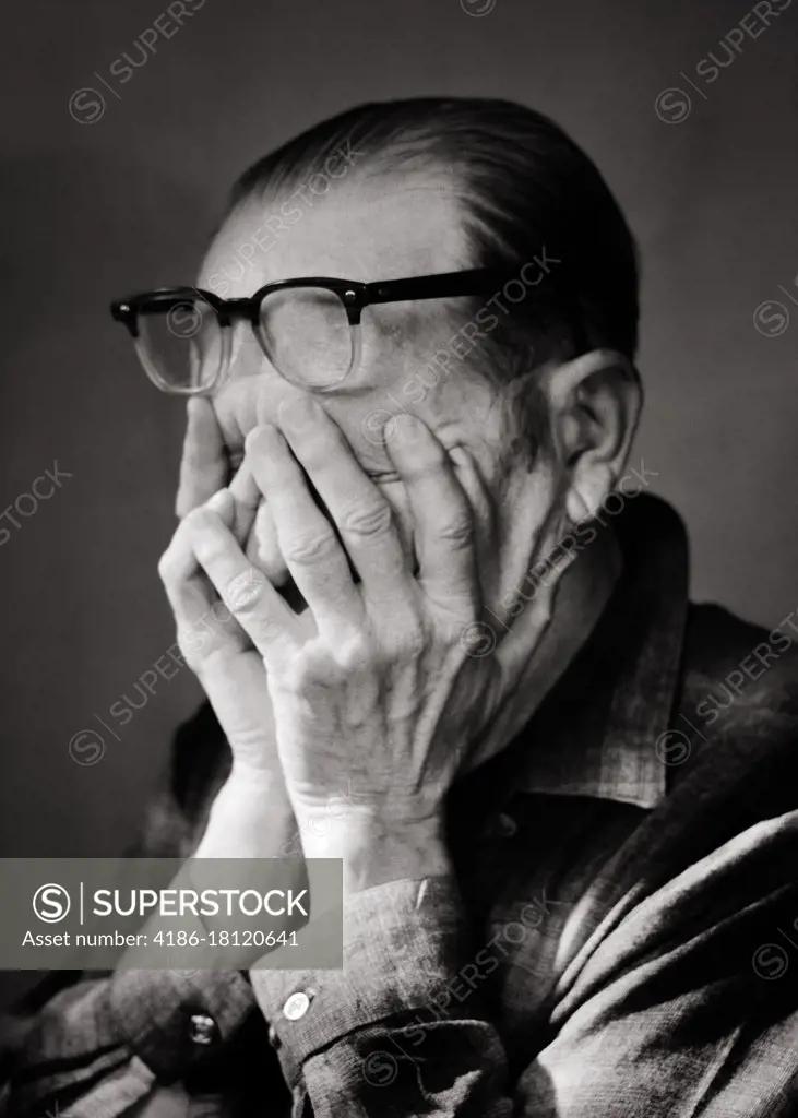 1970s PORTRAIT MATURE MAN HANDS COVERING FACE EYEGLASSES PUSHED UP ONTO FOREHEAD OVERWHELMED TIRED EXHAUSTED DEPRESSED