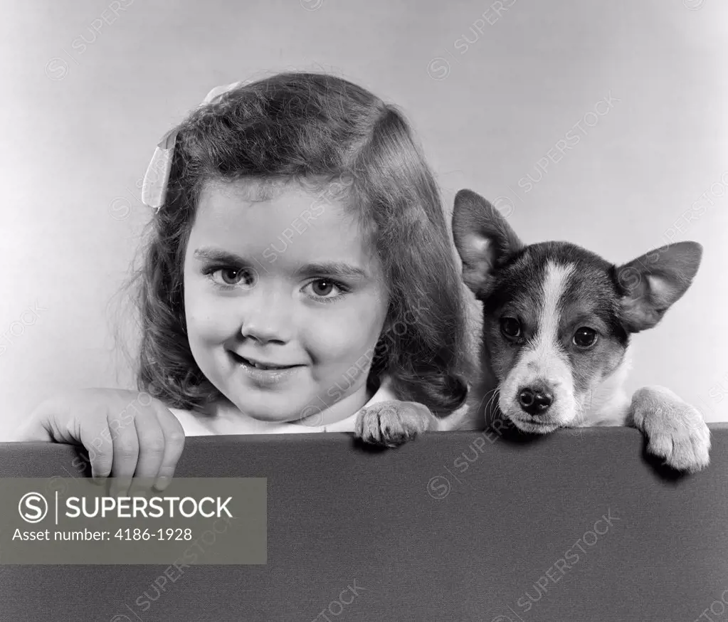 Portrait Of Little Girl With Small Dog Studio