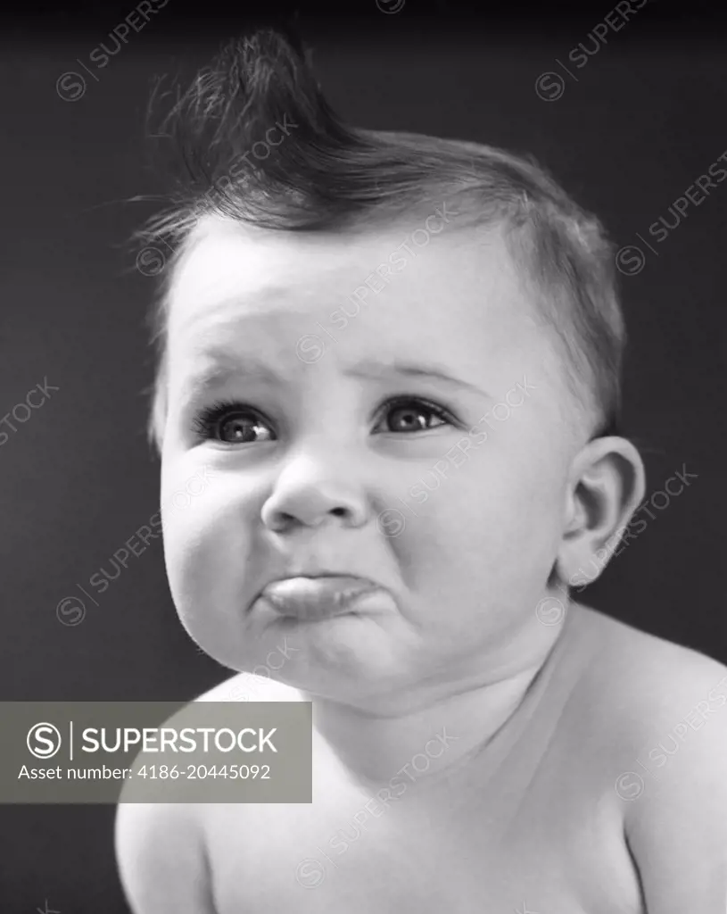 1940s 1950s SAD BABY WITH POUTING LOWER LIP EXTENDED ABOUT TO CRY