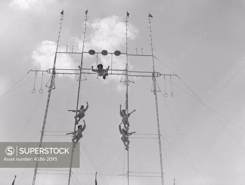 1950S Six Circus Performers On High Trapeze