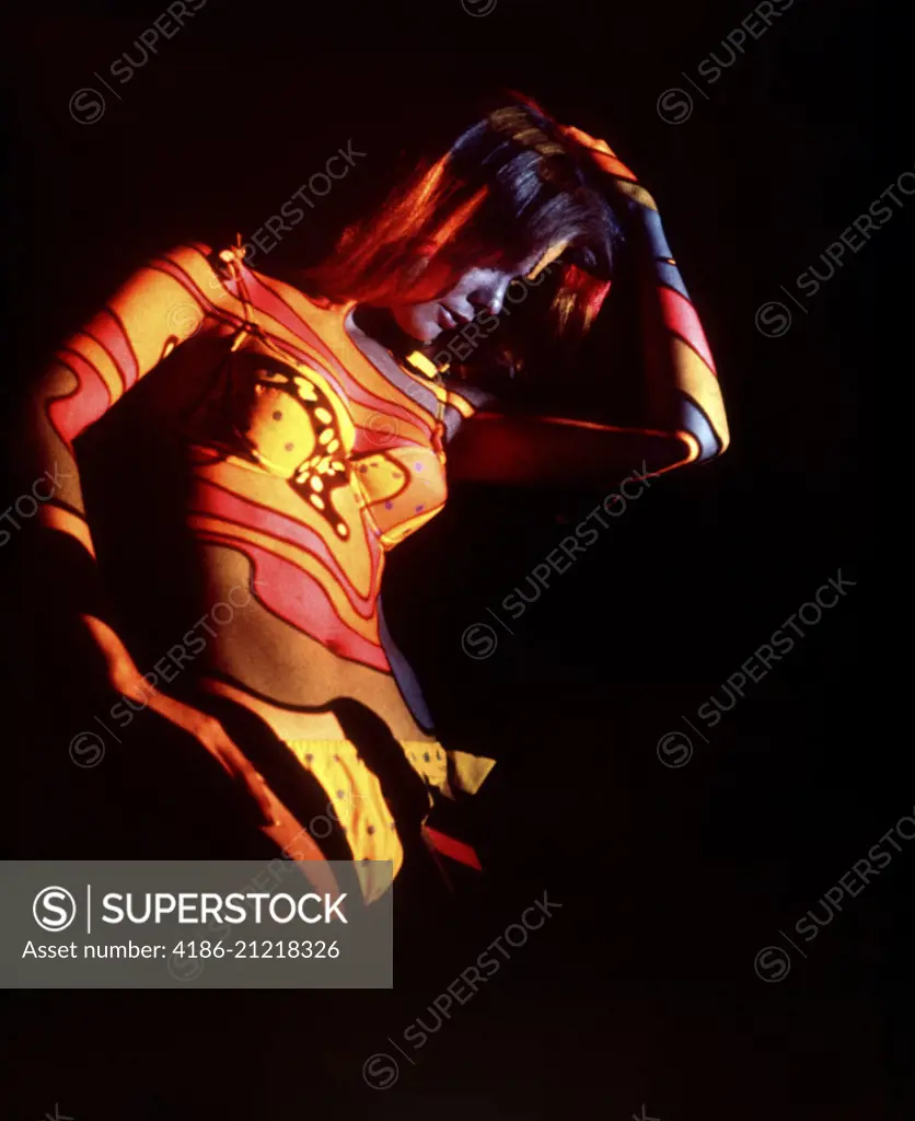 1970s COLORFUL PSYCHEDELIC PATTERN LIGHTS COLORS PROJECTED ONTO WOMAN BODY WEARING BIKINI DISCO DANCER