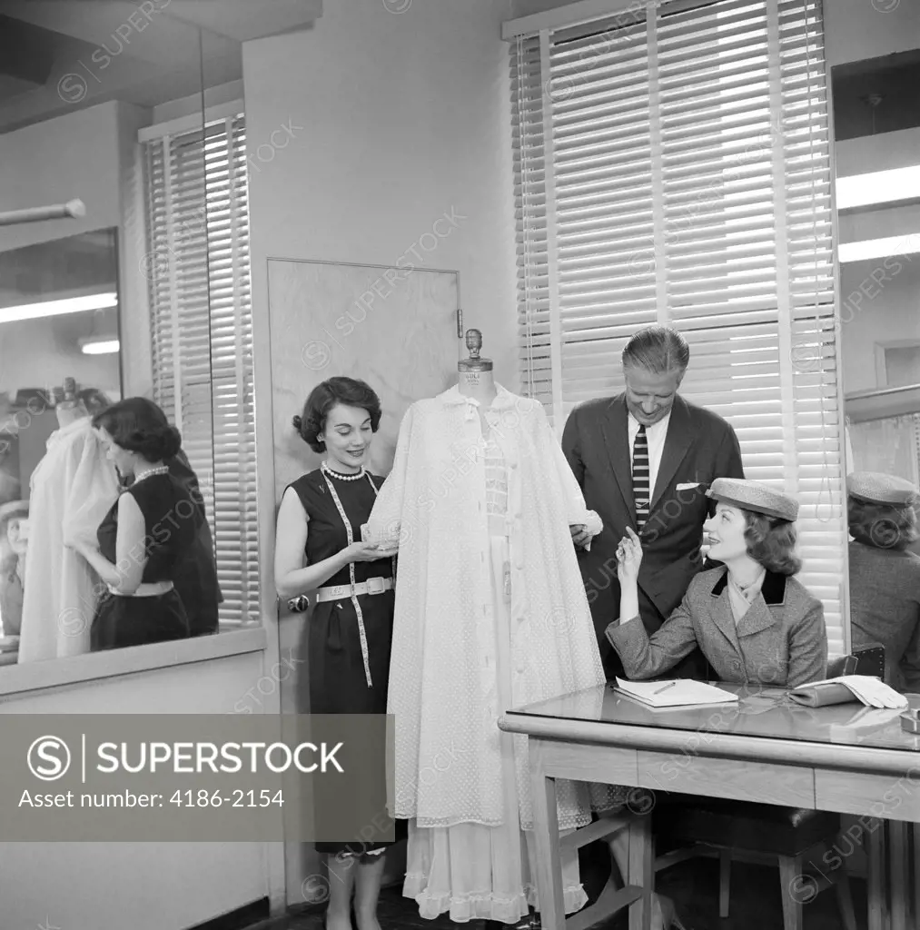 1950S Female Fashion Buyer Selecting Lingerie Clothing In A Garment Industry Showroom