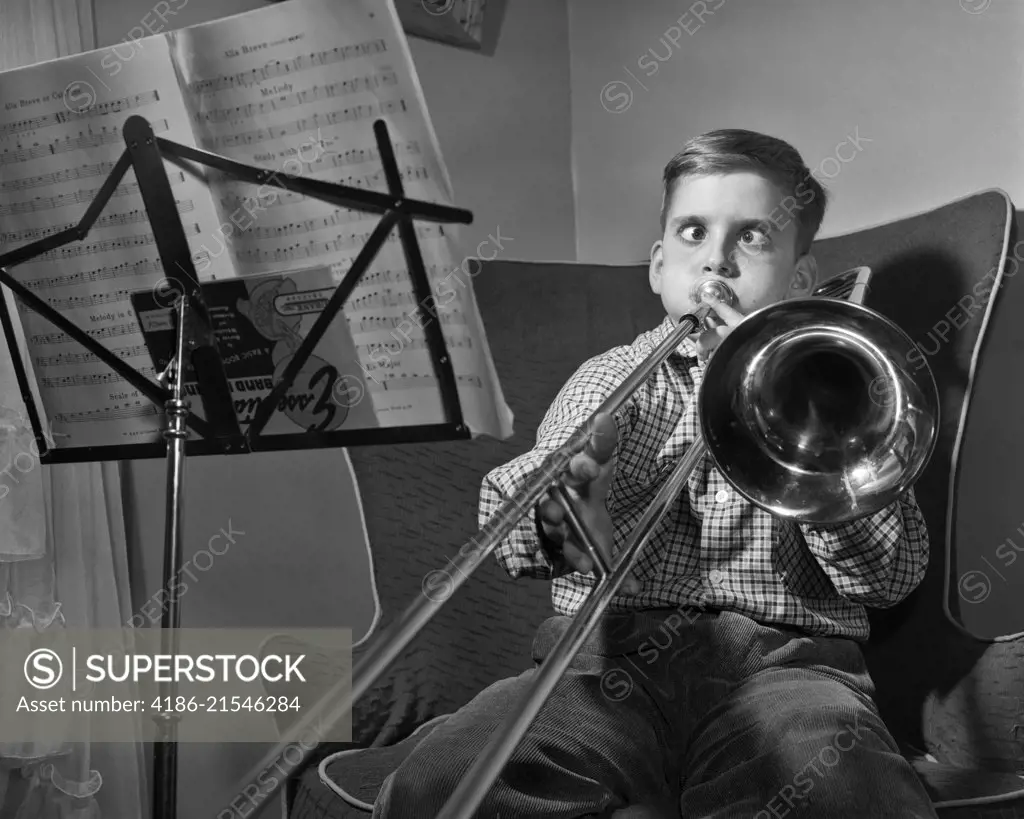1950s FUNNY CROSS-EYED BOY PLAYING SLIDE TROMBONE