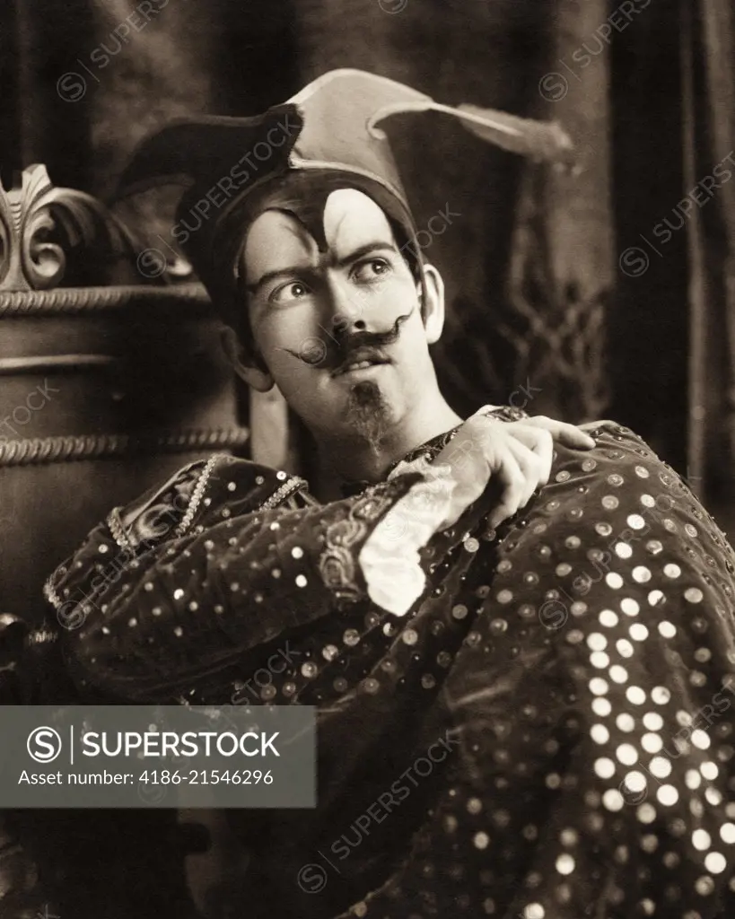 1900s MAN IN THEATRICAL COSTUME LOOKING TO SIDE SEQUINED JACKET MUSTACHE GOATEE SATANIC DEVIL CHARACTER MEPHISTOPHELES