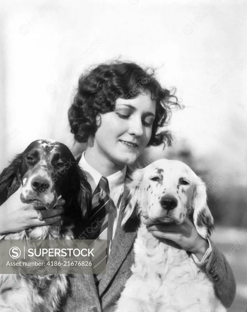1920s WOMAN HOLDING PETTING TWO ENGLISH SETTER DOGS OUTDOORS