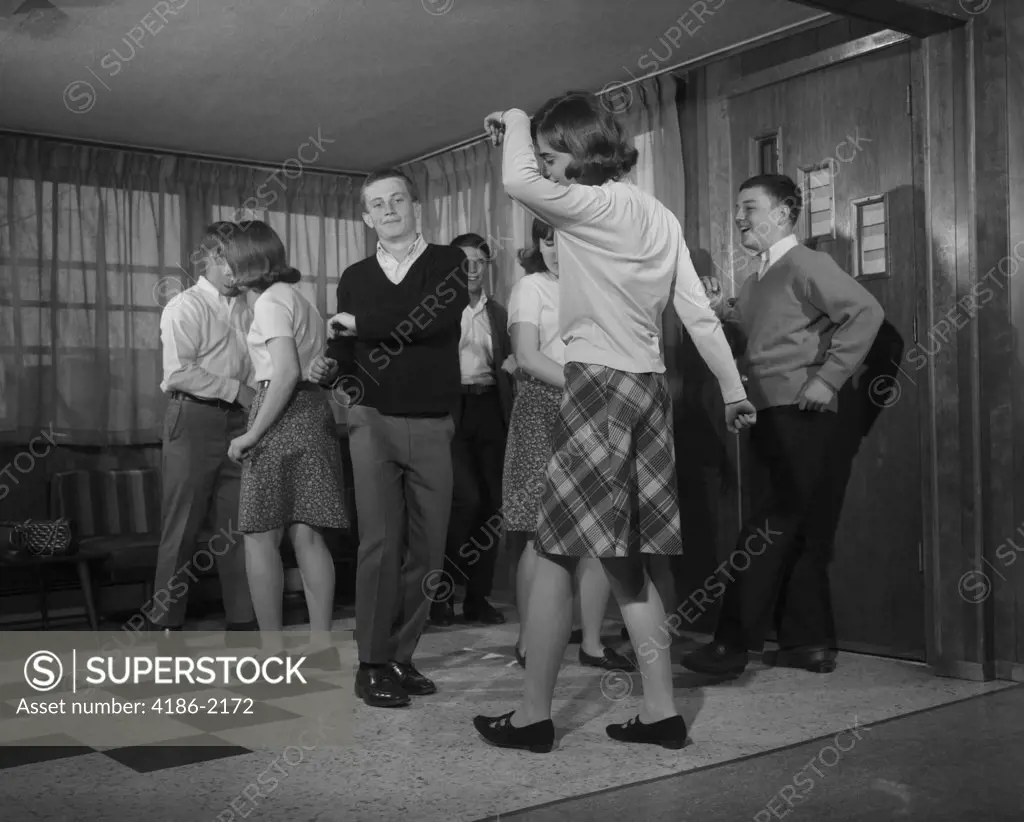 1960S Group Of Young Teenagers Dancing Inside