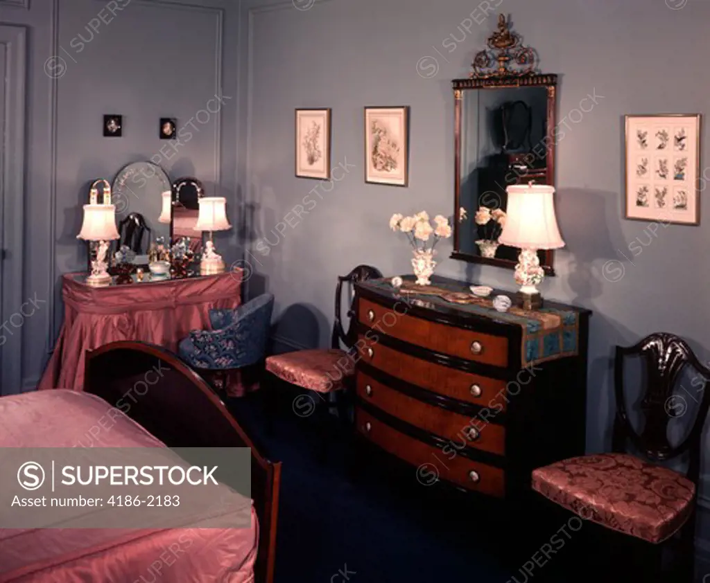 1940S 1950S Bedroom With Blue Walls Pink Bedspread And Skirted Vanity Table