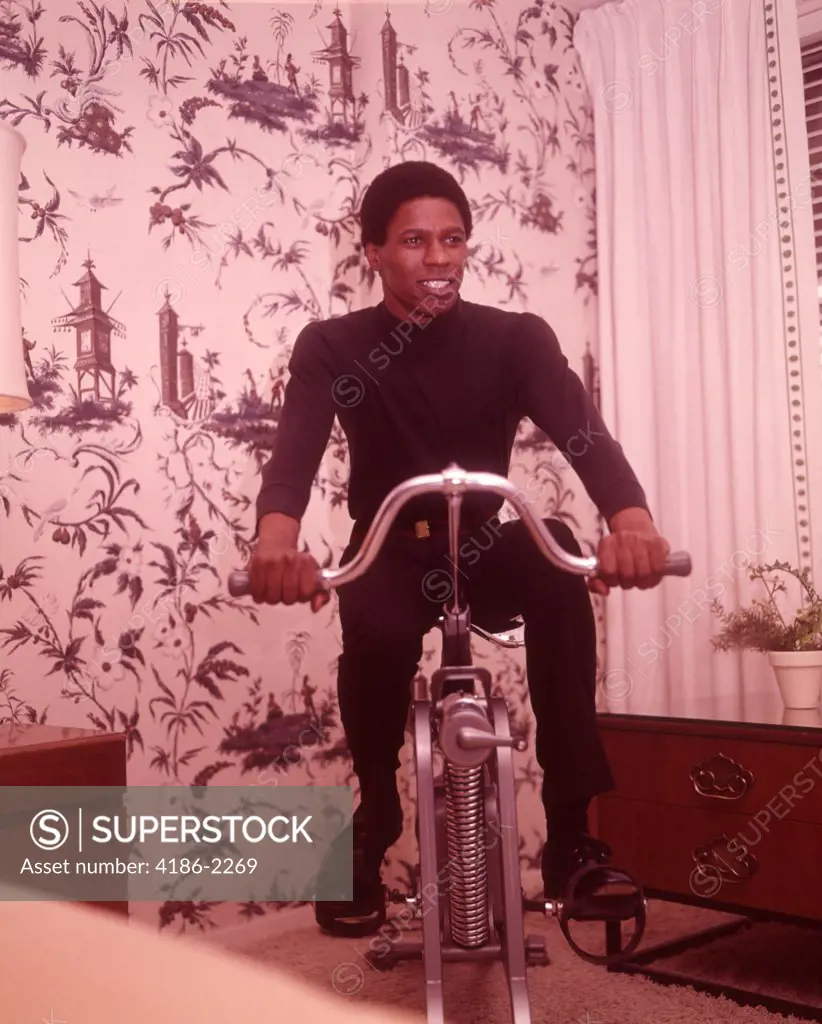 1960S African American Man On Exercise Cycle