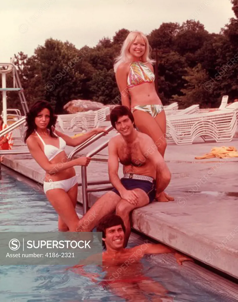 1960S 1970S Group Of Young People By Ladder Of Swimming Pool