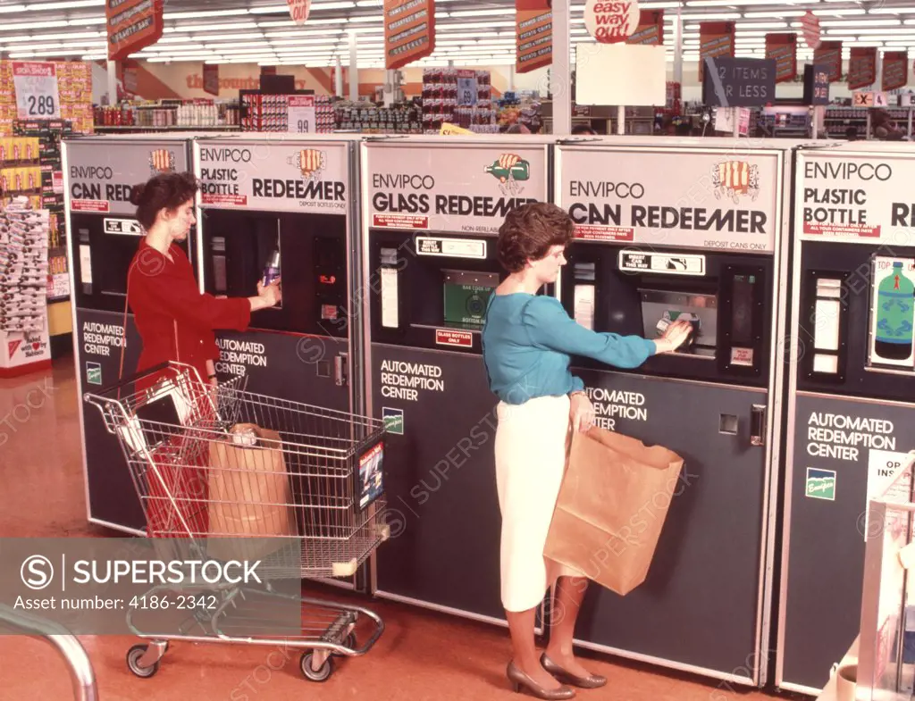 1970S Women Redeeming Deposit On Cans & Bottles At Supermarket Redemption Center