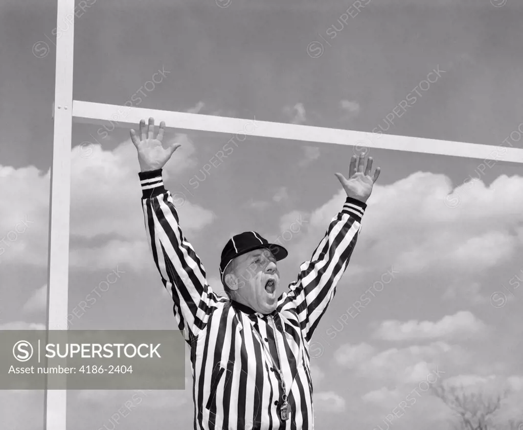 1960S American Football Referee Making Touchdown Hand Signal At Goal Post 