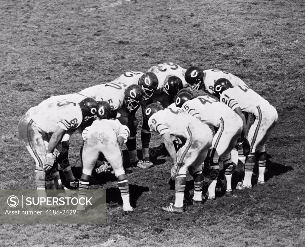 1960S Football Team Huddle