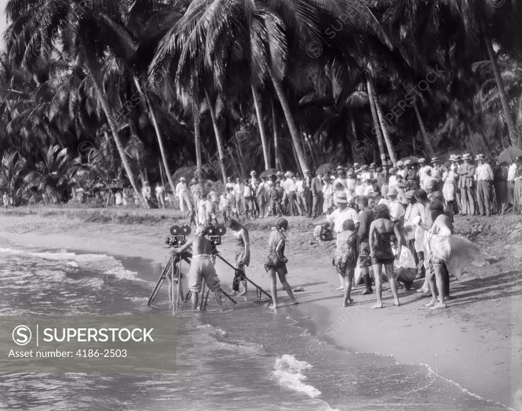 1920S Movie Crew With Cameras On Tripods In Surf On Tropical Beach