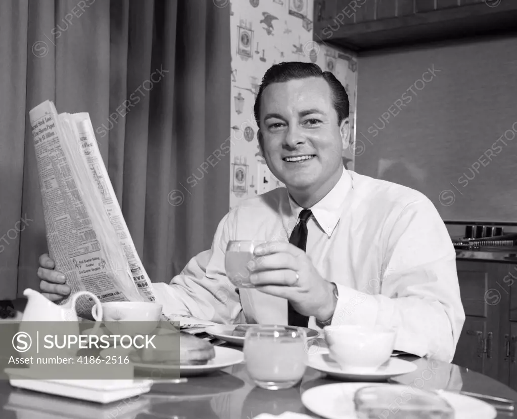 1960S Smiling Man Eating Breakfast Reading Newspaper 