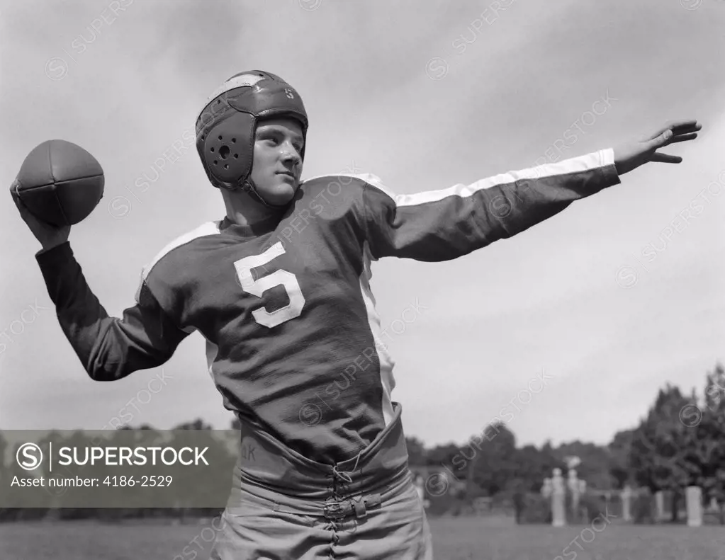 1940S Young Teen Quarterback About To Toss Football Pass