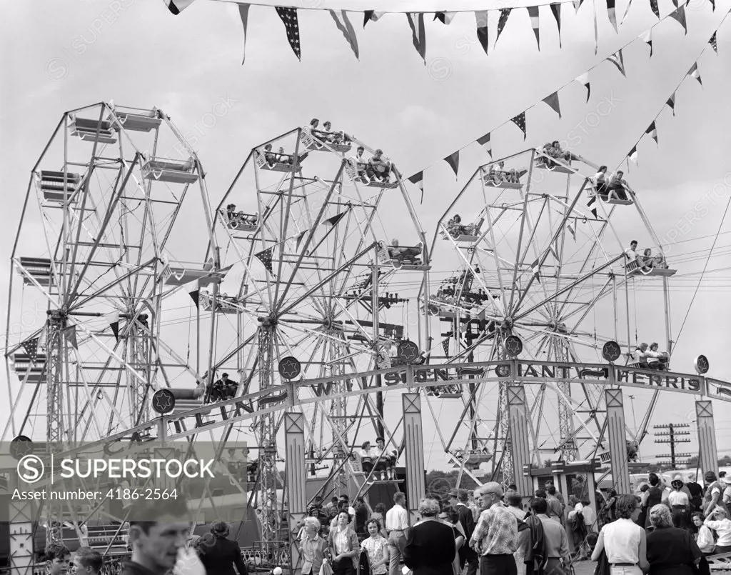 1950S Fair Scene Showing 2 Giant Ferris Wheels & Crowd Below