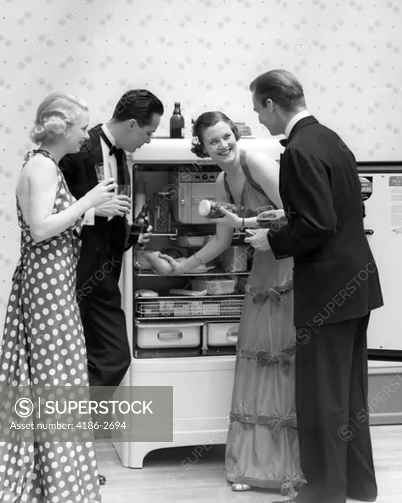 1930S Pair Of Couples In Formal Dress Raiding The Refrigerator