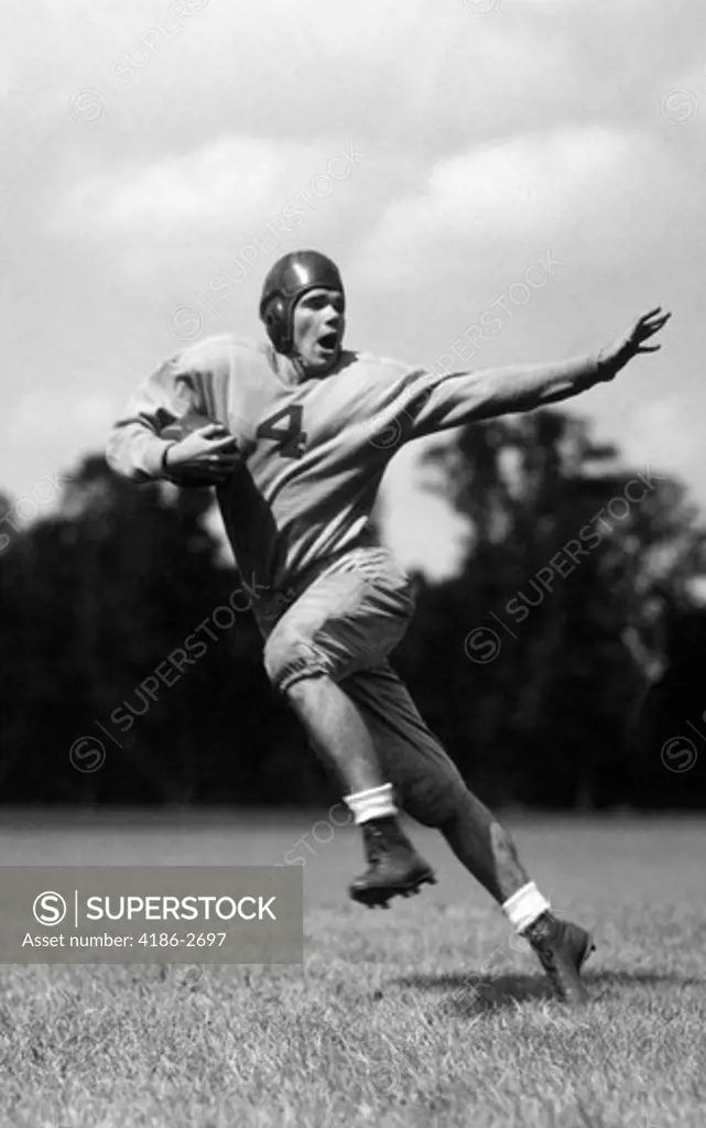 1930S Football Player Running With Ball