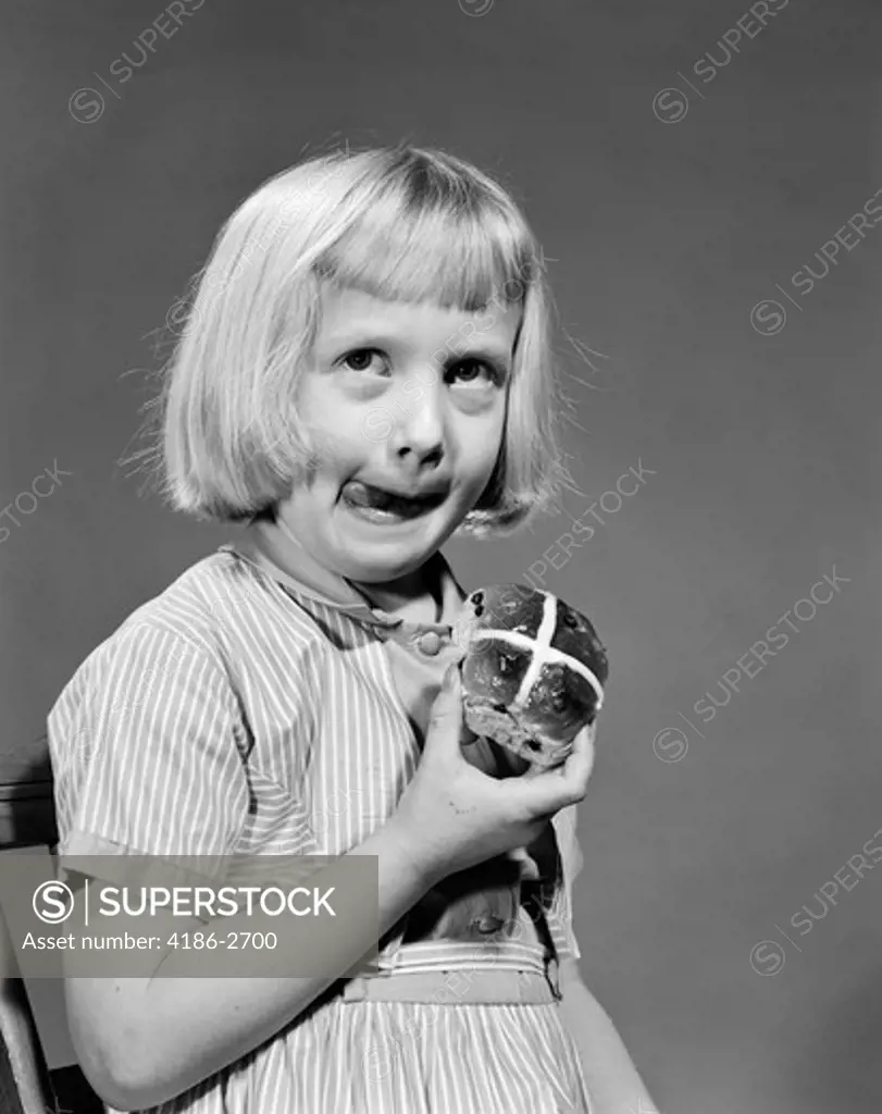 1950S 1960S Blonde Girl Licking Her Lips Eating Hot Cross Bun
