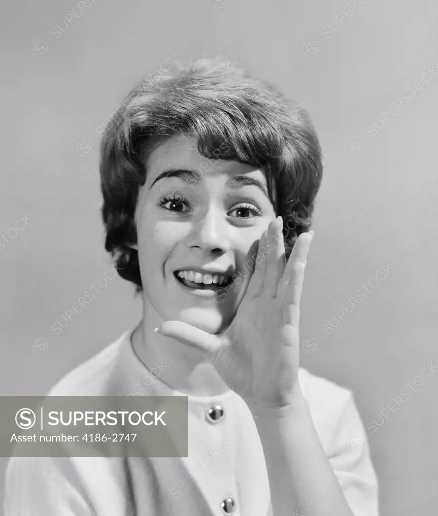 1950S Woman Yelling With Hand Held Up To Her Face