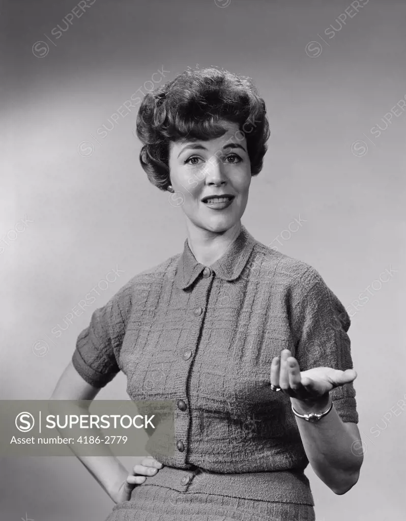 1950S Brunette Woman Knit Dress Offhand Gesture Serious Expression