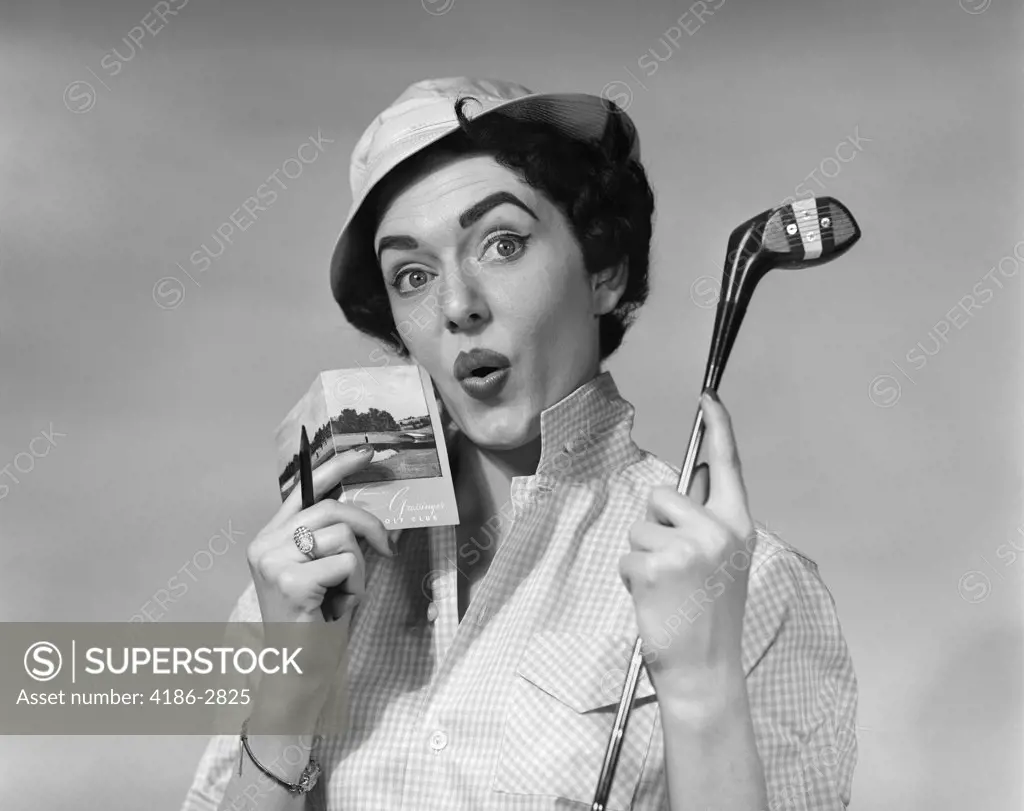 1950S Woman Holding Golf Club Driver And Score Card & Pencil In Other Hand Par Worried Expression Wearing Hat And Checked Blouse