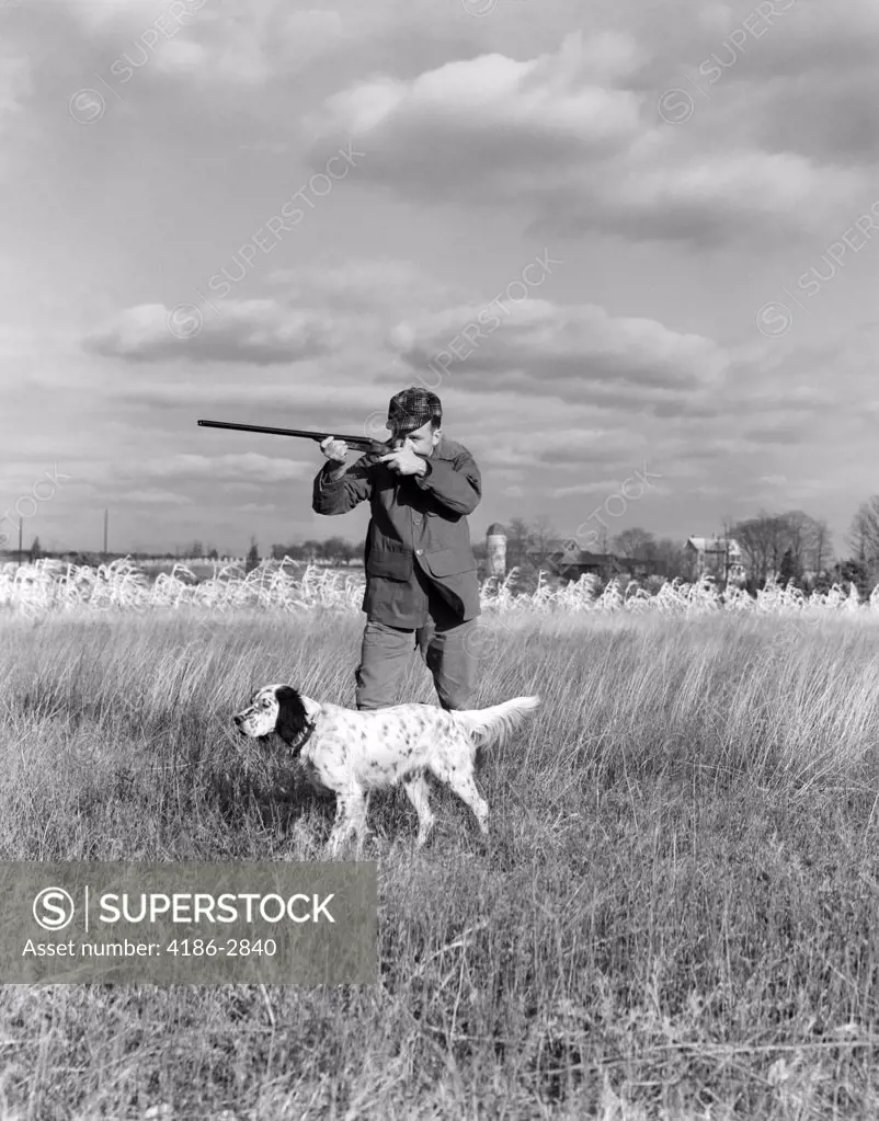 1930S 1940S Man Bird Hunting In Field With Dog Aiming Shotgun 
