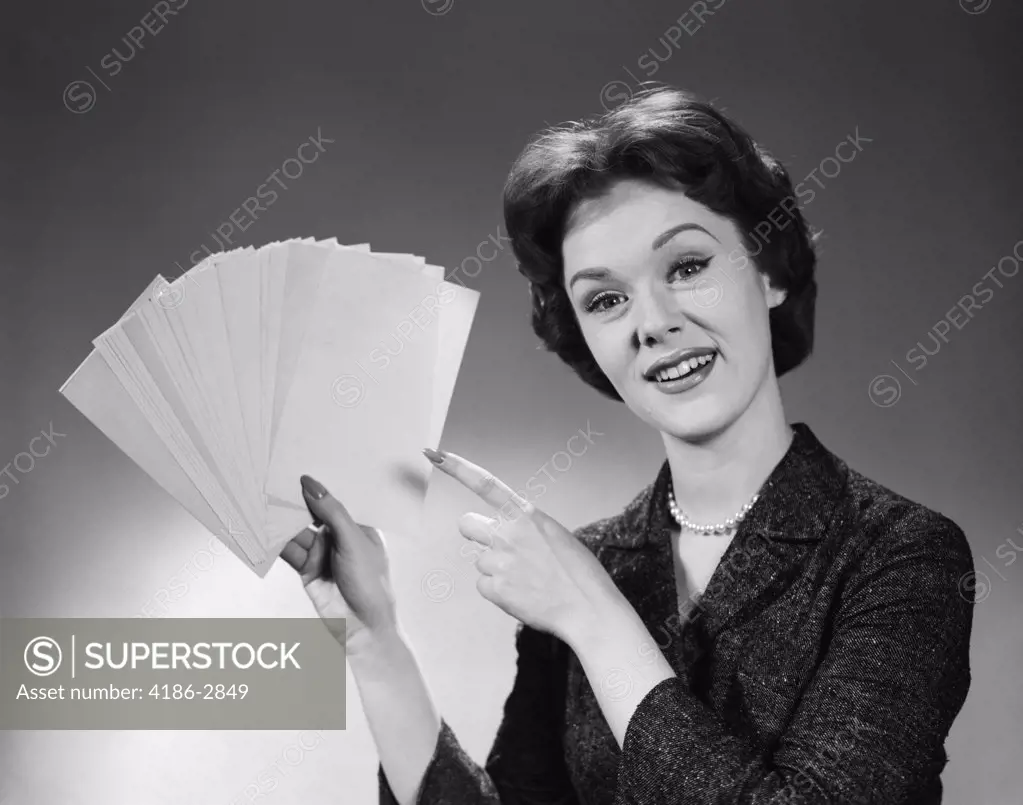 1960S Smiling Woman Holding Fanned Deck Of Blank Index Cards