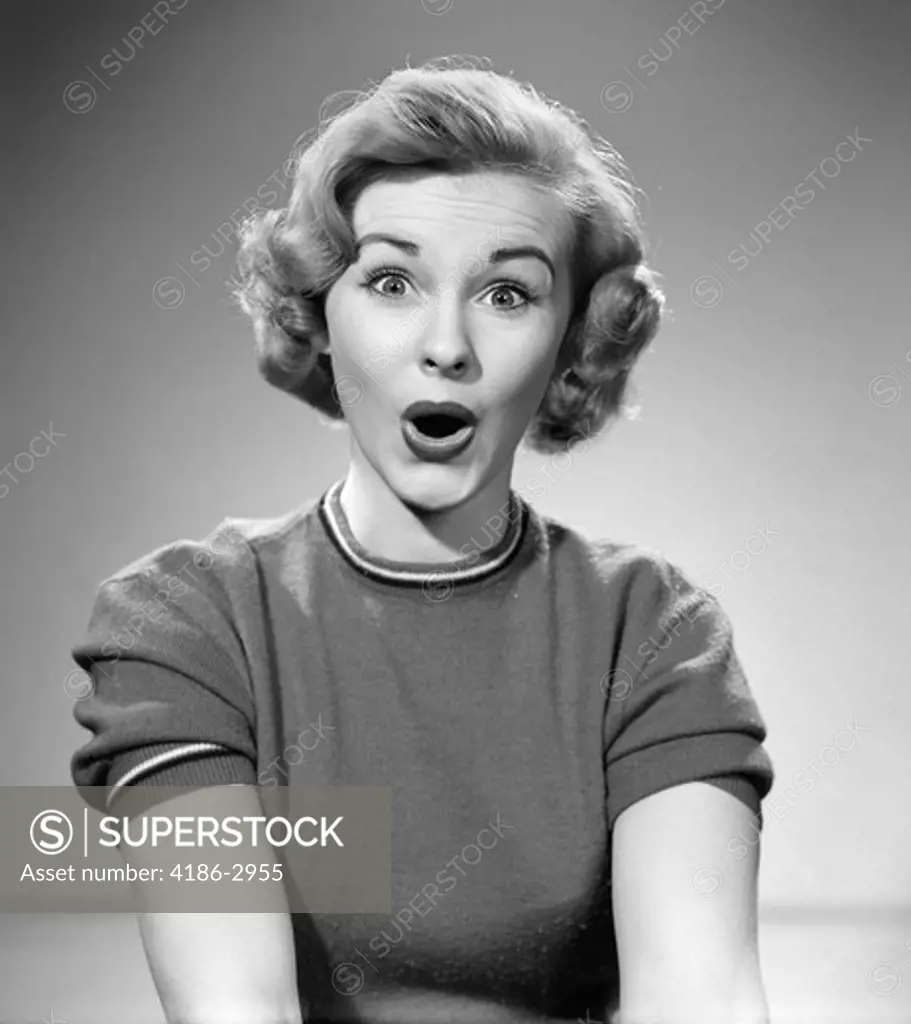 1950S Head Shot Of Woman Eyes And Mouth Wide Open Surprised Expression Indoor
