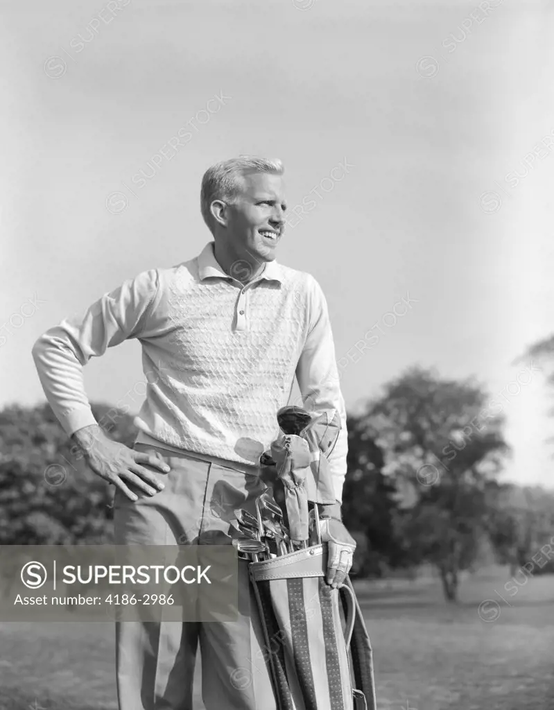 1960S Smiling Blond Man Handsome Stand With Golf Bag Cubs Irons Looking Down Fairway Of Golf Course Athlete