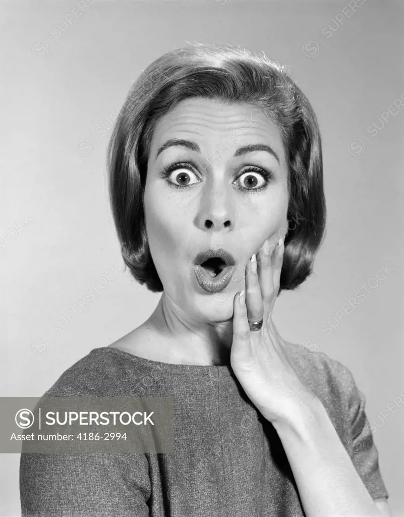 1960S Portrait Woman With Hand On Cheek With Shocked Expression