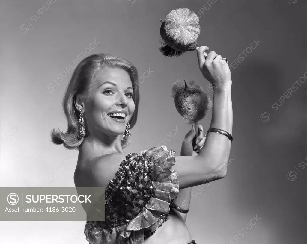 1960S Smiling Blond Woman Shaking Noise Makers In Her Hands Wear Ruffled Halter Top Latin Music Dance Perform