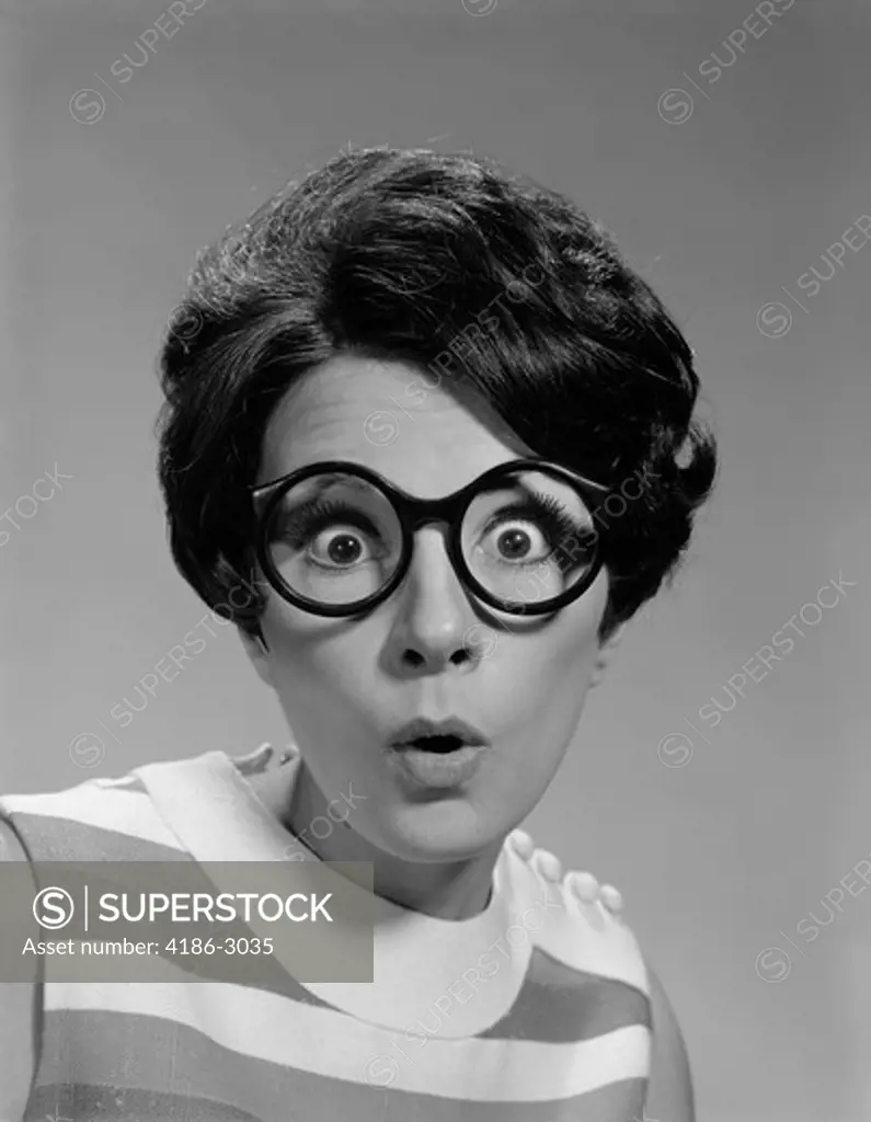 1960S Portrait Brunette Wearing Dark Thick Round Eyeglasses With Eyes Wide Open