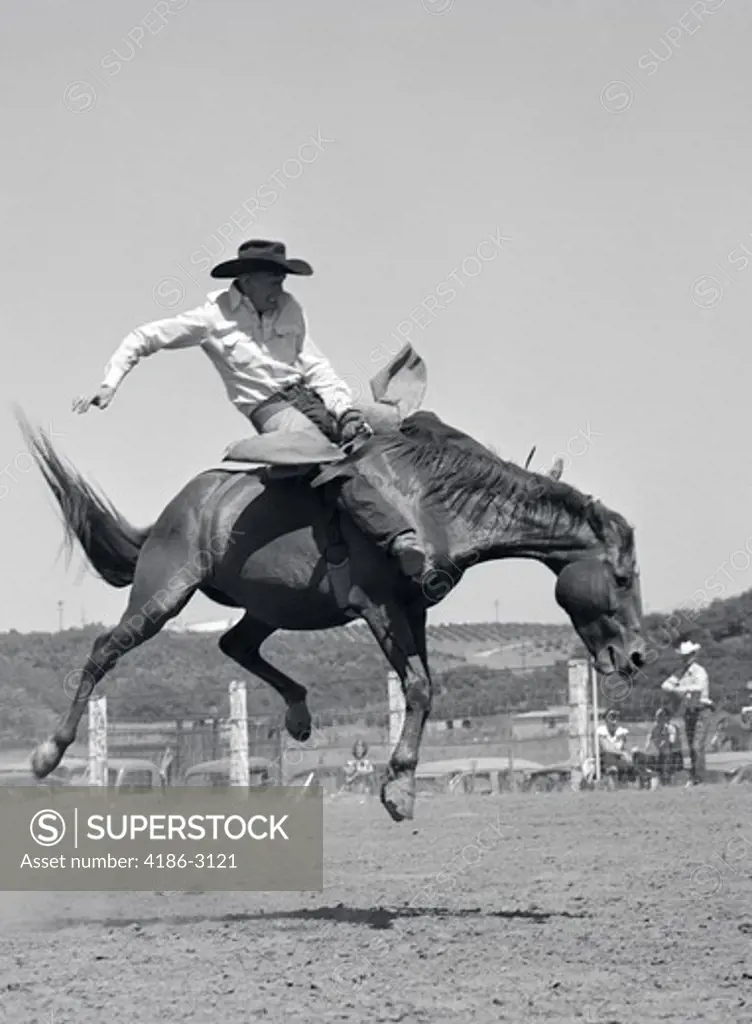 Cowboy Riding A Horse On A Ranch