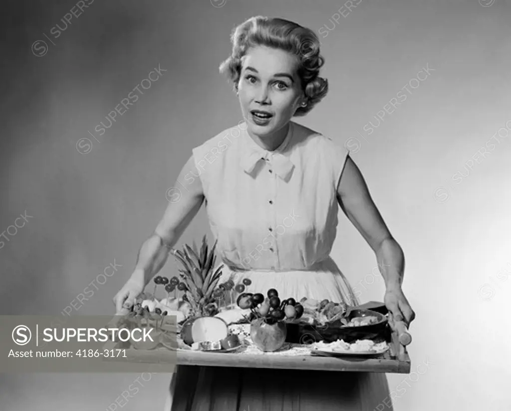 1950S Woman Looking At Camera Speaking Holding Platter Of Hors D'Oeuvres Snacks