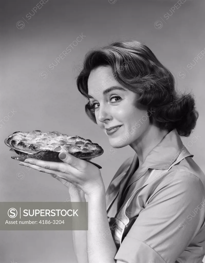 1950S 1960S  Woman  Smiling Holding Freshly Baked Pie