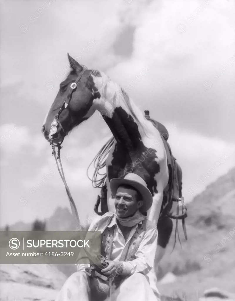 1930S Cowboy Sitting In Front Of Horse Holding Reins Spotted Paint Pinto