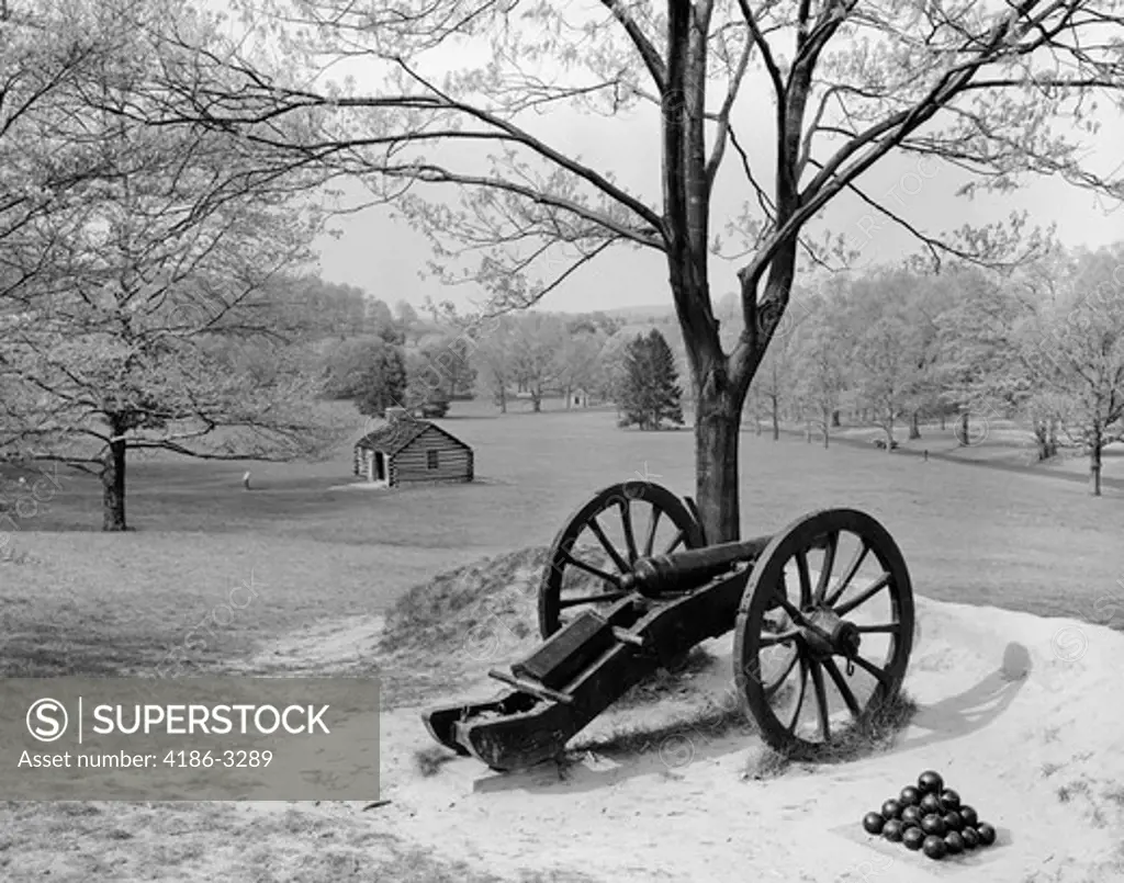 Overview Of Landscape At Valley Forge With Cannon In Foreground & Cabin In Background