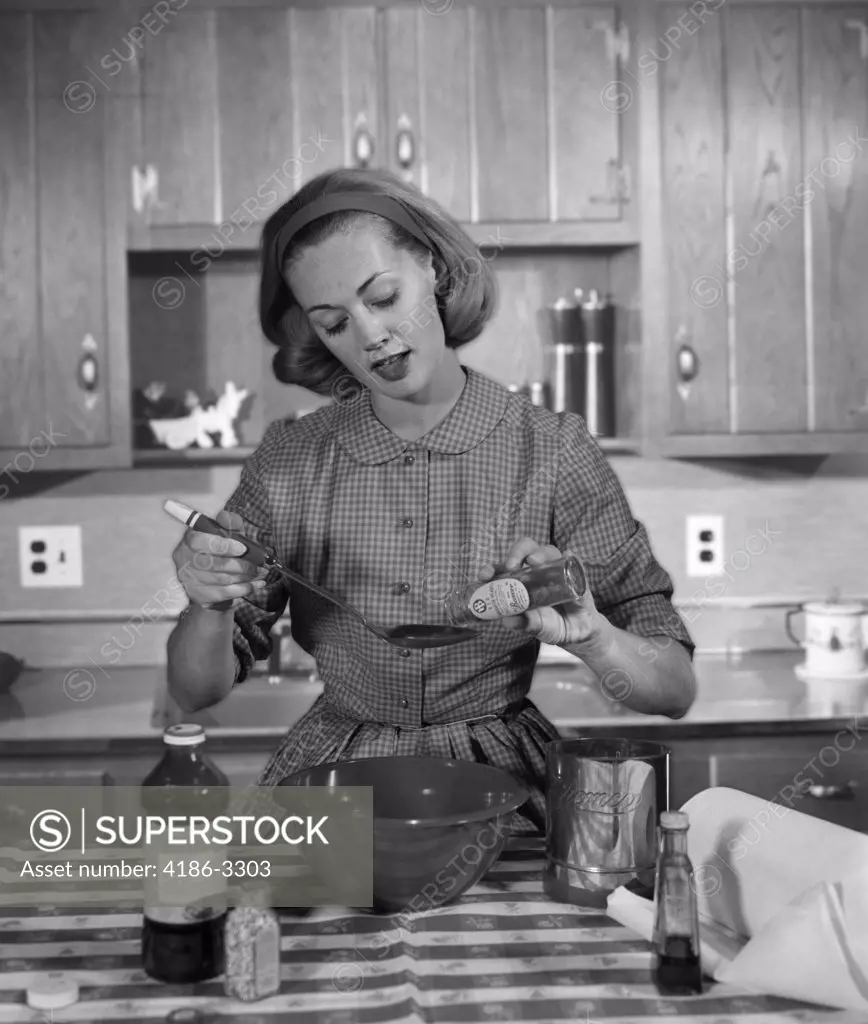 1960S Woman Baking In Kitchen