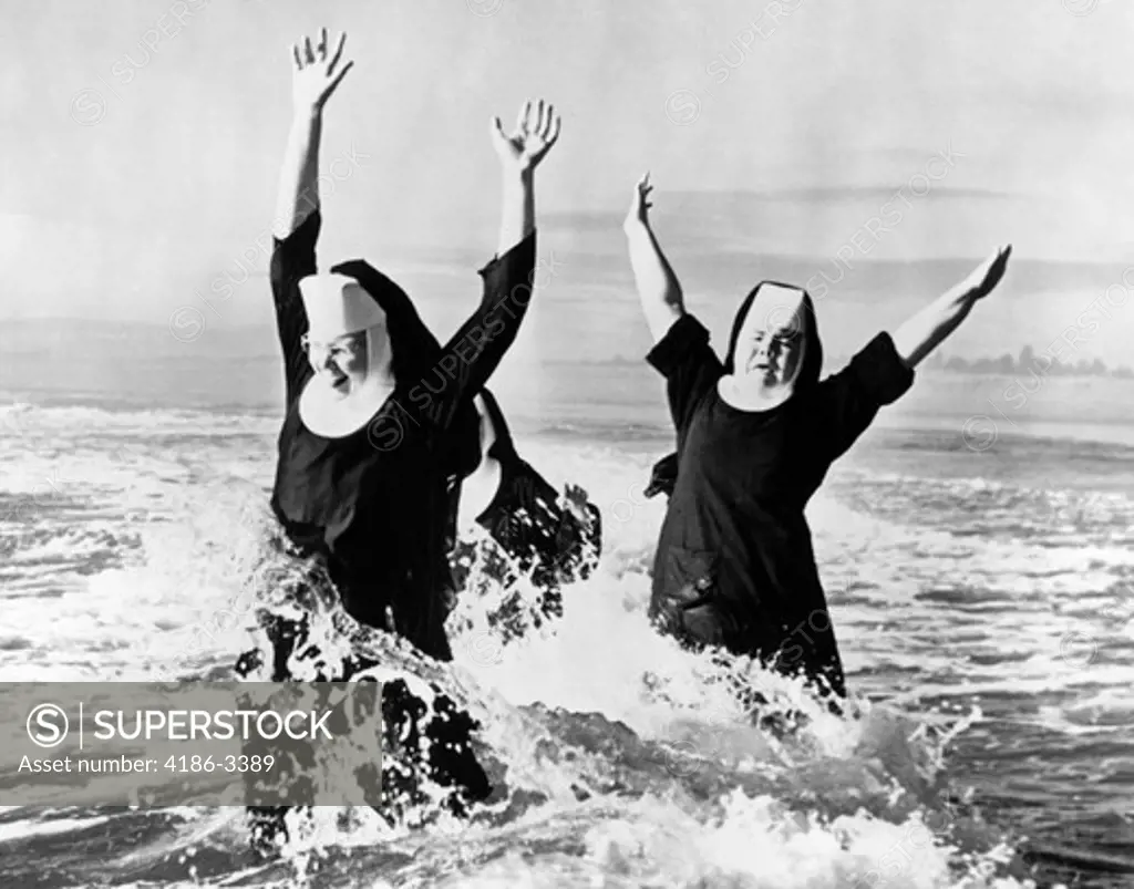 1950S Three Nuns Wearing Habits Laughing Jumping In Ocean Surf