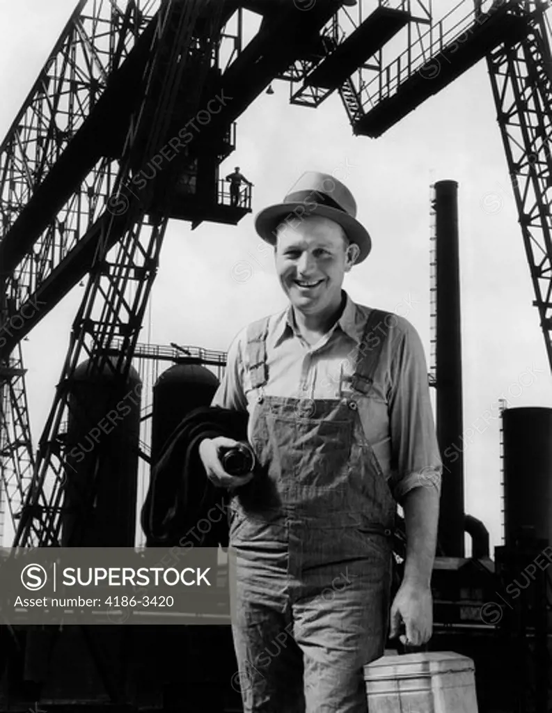 1930S Composite Of Worker In Front Of Factory