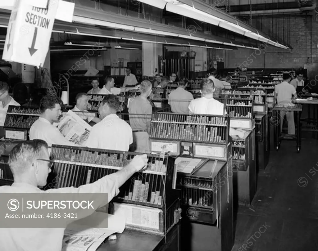 Men Working In Newspaper Advertisement Composing Room Setting Ad Type Indoor 1950S