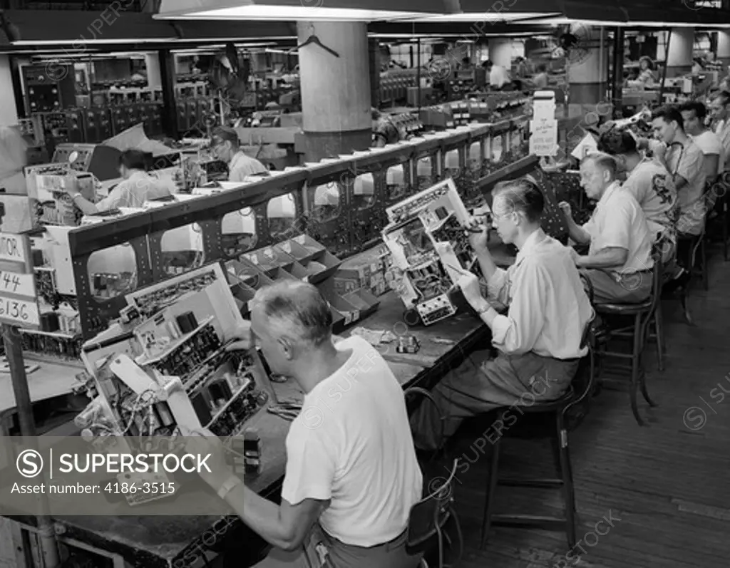 1950S Men In Electronics Factory Working On Television Assembly Line Indoor