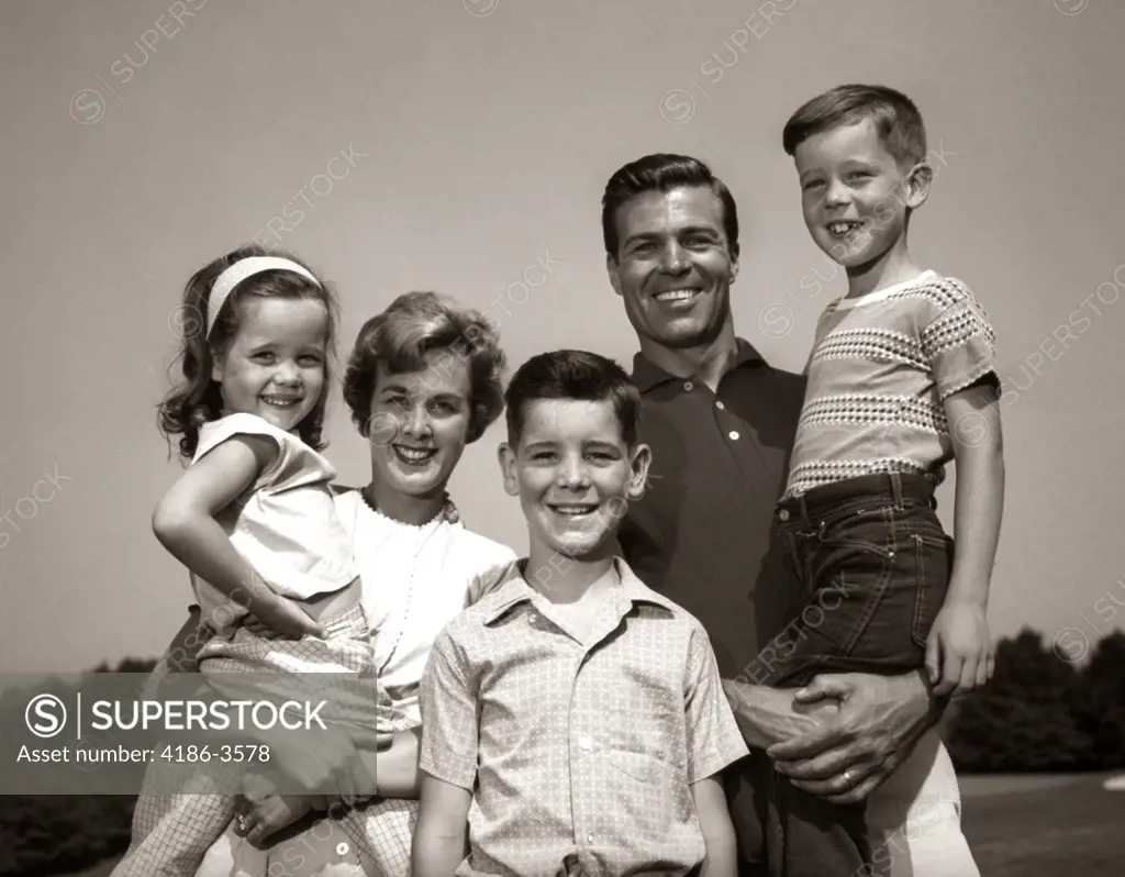 1960S Family Portrait Outdoors Father Mother Three Children   
