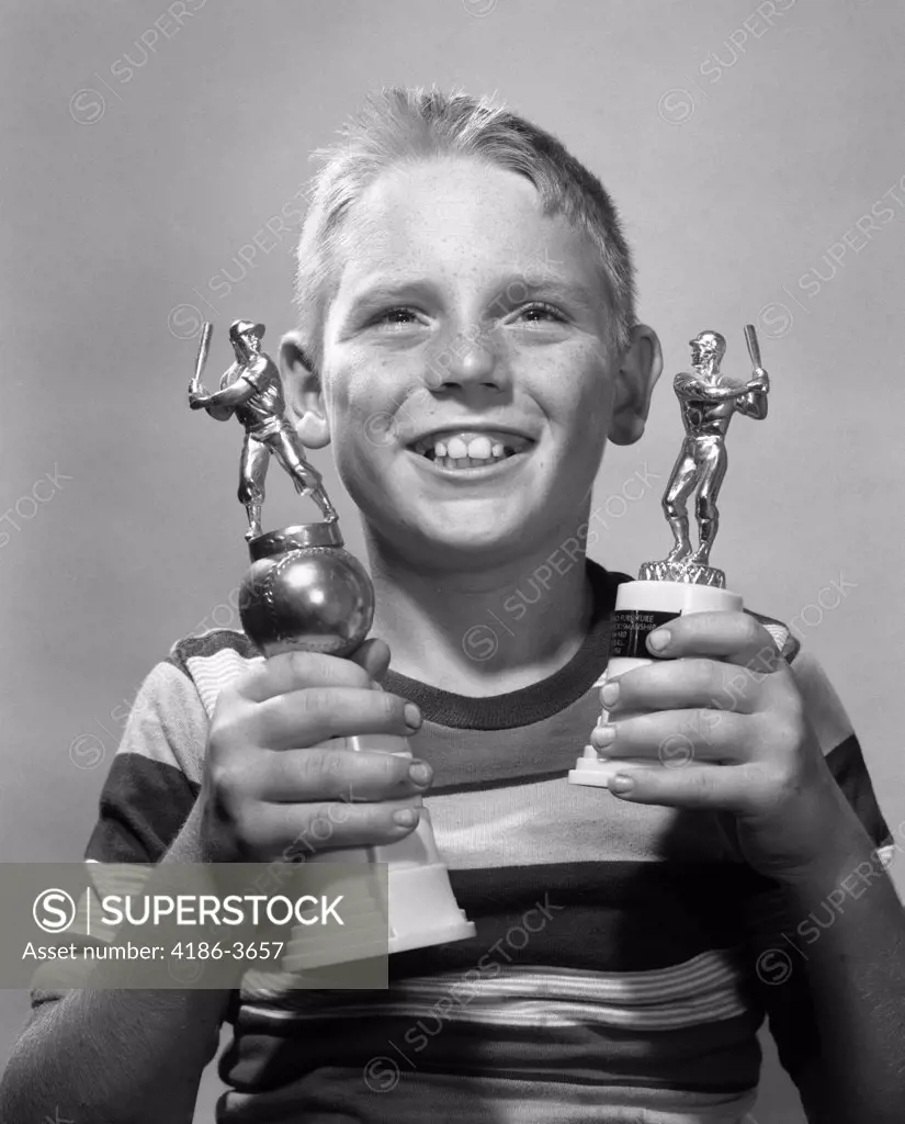 1950S 1960S Smiling Boy Holding Two Baseball Trophies