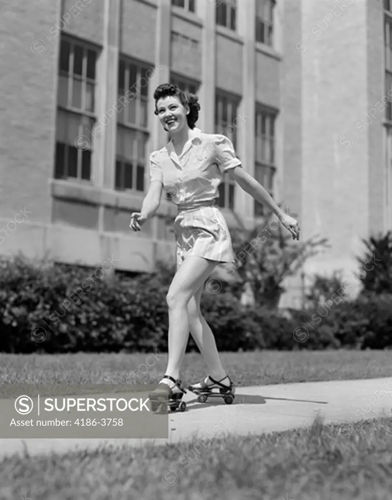 1940S Smiling Teen Girl On Roller Skates Skating On Sidewalk