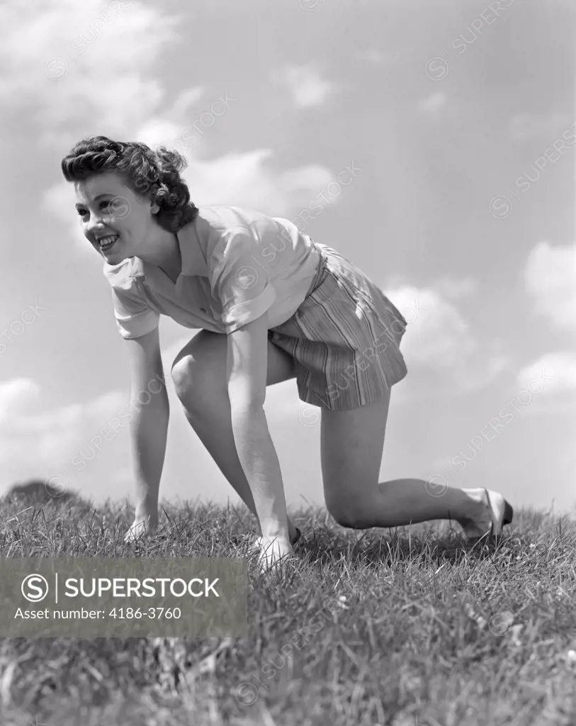 1940S Smiling Young Teen Woman Kneeling In Grass In Track Race Ready Starting Position