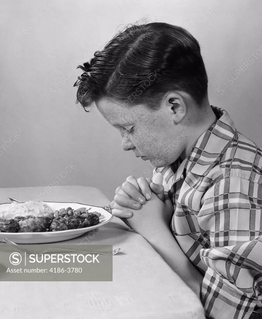 1950S Boy Child Praying At Table Dinner
