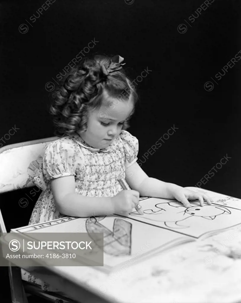 1960S 1940S Girl Child Sitting At Desk Drawing Coloring Pictures